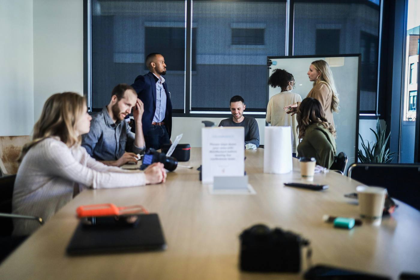 Team meeting in a busy office